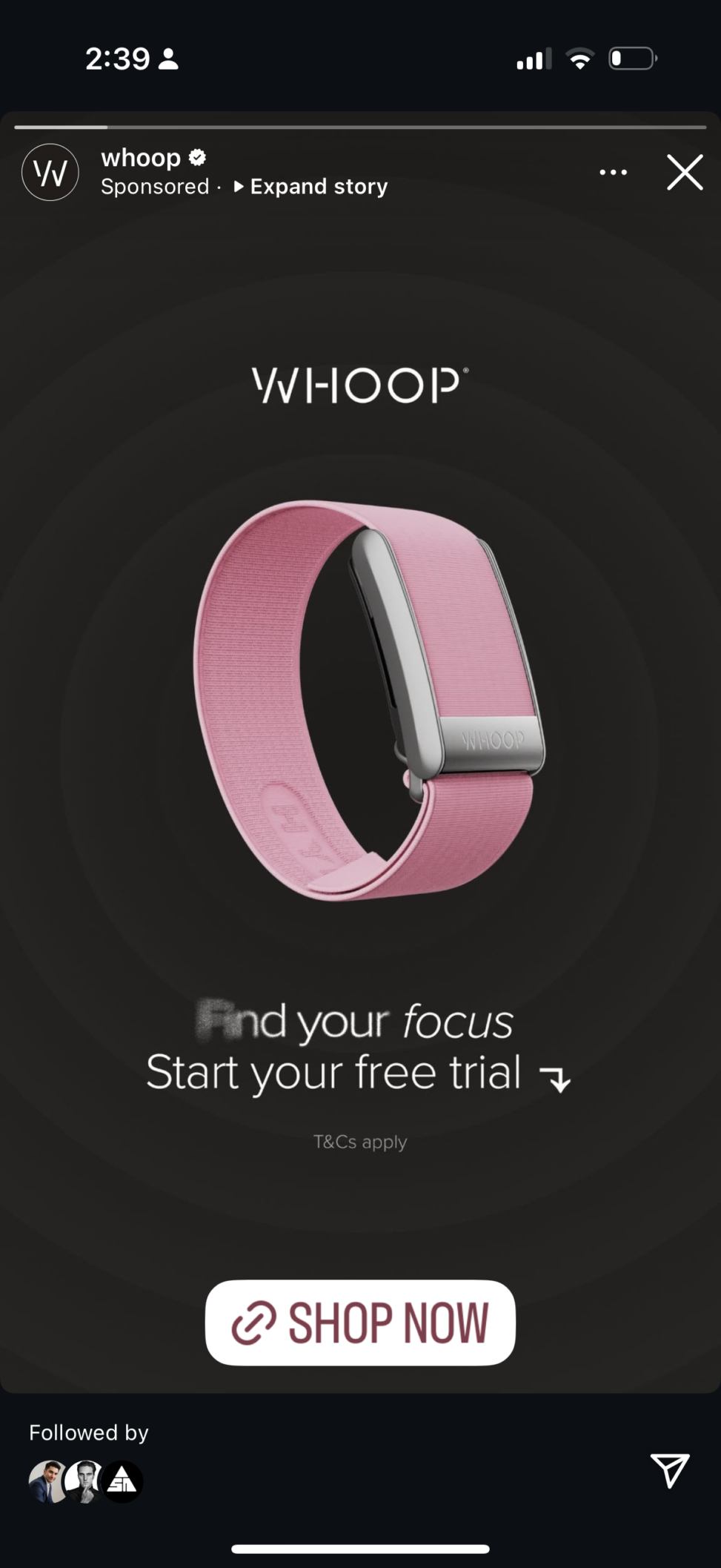 Whoop advertisement featuring a fitness tracker\'s with the text \'Find your focus\' and a \'Shop Now\' button, promoting a free trial.