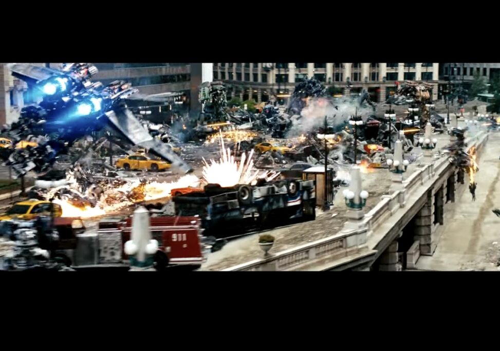 The most recent Hollywood action movie I watched was Transformers: Dark of the Moon (2011), and the screenshot I took comes from one of the big battle scenes in downtown Chicago. This moment really shows how modern franchise action movies try to overwhelm the viewer with destruction, speed, and CGI. The frame is honestly chaotic: a Decepticon ship tearing through the sky, explosions going off in the street, cars flipped over and burning, and tiny human figures being tossed around in the background. There isn’t one main thing to focus on because there’s so much happening at once. That overload is basically the film’s whole approach to action. In my screenshot, the mise en scène stacks mechanical violence on top of an already wrecked city space. You can see burned-out vehicles, cracked pavement, debris everywhere, almost no part of the frame is calm. The brightest spot is the blue glow coming from the Decepticon ship, which naturally pulls your eyes toward the robot instead of the people running below it. The humans look small and exposed, which is one of the movie’s main ideas: humans don’t stand a chance against these giant alien machines. That imbalance shows up all through the film, and this frame captures it perfectly. When you look at the shots before and after this moment, the editing is extremely fast. During about a minute of the Chicago battle, there are dozens of quick cuts jumping between wide aerial shots, collapsing buildings, explosions, and close-ups of soldiers trying to escape. I felt like I never stayed in one POV for more than a second. One moment I’m behind a flying Decepticon, and the next I’m dropped back to ground level surrounded by smoke and fire. Lisa Purse talks about this type of editing as a way to “immerse the viewer in the sensory overload of combat,” and the movie definitely does that. Even though the film tries to make the transitions smooth, the constant cutting makes me super aware of the camera. The camera movement is also exaggerated and definitely not how a real person would see things. It swoops, spins, and dives into angles that would be impossible in real life. Instead of trying to hide the camera, the movie basically shows off what it can do. Geoff King calls this the “spectacle-driven aesthetic” of blockbusters, where the main goal is to create huge visual moments, not realism. The way the film cuts mid-explosion or mid-transformation adds to that feeling. It never lets the viewer settle into one shot before another one crashes in. The action in the frame is fast, loud, and visually packed. The robots move with impossible strength, destroying cars or entire parts of buildings in one move. The city feels like it was designed just to be torn apart. Most of the characters you see are men, especially soldiers, who are yelling or firing weapons that don’t really do anything against the robots’ tech. This lines up with Yvonne Tasker’s idea of “muscular spectacle,” where action movies put male bodies in the middle of danger even when the real power comes from something non-human. A lot of scholars say the same things we see in this screenshot, hyper-fast cutting, huge CGI destruction, and total visual overload are trademarks of today’s Hollywood blockbusters. With the rise of digital effects, directors build action scenes around destruction because they know audiences will respond to it. Purse argues that these movies train viewers to expect high levels of visual stimulation, almost to the point where calm scenes feel empty. This single image from Dark of the Moon fits exactly into that trend. On top of that, the movie was a massive commercial success. It made over $1.1 billion worldwide, which shows that audiences clearly support this kind of CGI-heavy, destruction-focused action filmmaking. The franchise basically built its reputation on scale and chaos, and people still show up to see it. As for real-life impact, some scholars say that constant exposure to this kind of destruction can shape how viewers process violence. It’s not like one movie suddenly makes someone desensitized, but watching this style repeatedly can make large-scale destruction feel normal or even entertaining. Action films also help shape ideas about masculinity, military power, and technology. Even though movies like Dark of the Moon don’t directly cause behavior, they still play a role in building cultural ideas around conflict, heroism, and power. Overall, the screenshot I captured shows exactly what the Transformers franchise is known for: massive destruction, overwhelming movement, and a visual style built on chaos. It also reflects the bigger trends in modern action filmmaking, where spectacle comes first and everything else, including the human characters comes second. Box Office Mojo. “Transformers: Dark of the Moon.” Accessed November 2025. https://www.boxofficemojo.com/title/tt1399103/. King, Geoff. Spectacular Narratives: Hollywood in the Age of the Blockbuster. London: I.B. Tauris, 2000. Purse, Lisa. Contemporary Action Cinema. Edinburgh: Edinburgh University Press, 2011. Tasker, Yvonne. Spectacular Bodies: Gender, Genre and the Action Cinema. London: Routledge, 1993.